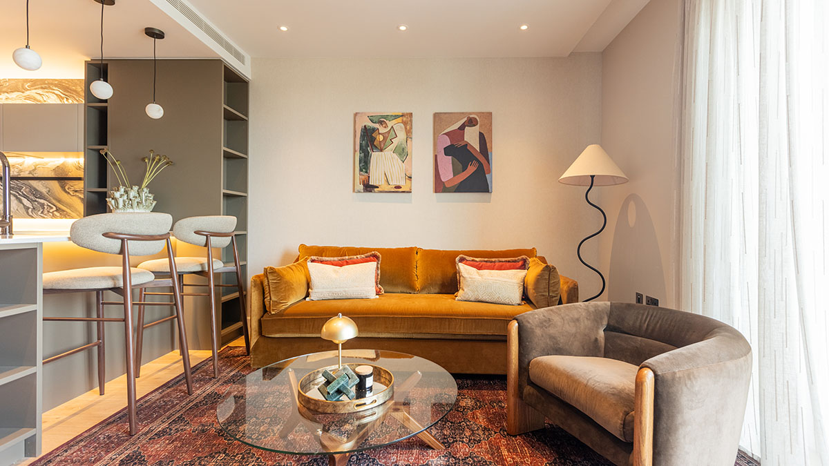 Open plan living and kitchen area in Dubai apartment after handover with modern interior design