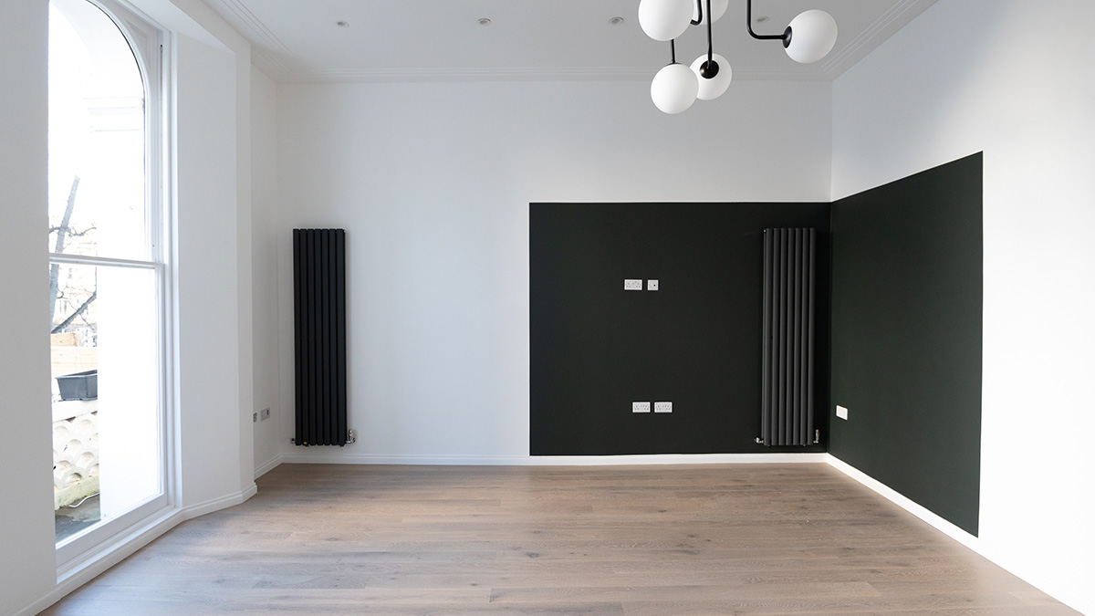 Empty living room in Dubai apartment before furnishing and property handover completion