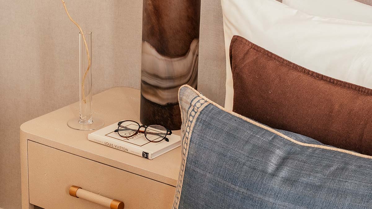 Open-plan dining and living area in a Dubai apartment with modern luxury furnishing