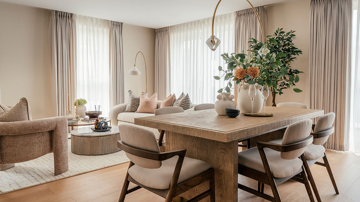 Open-plan dining and living area in a Dubai apartment with modern luxury furnishing